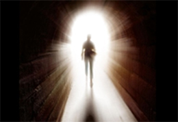 Image of a person walking through the light